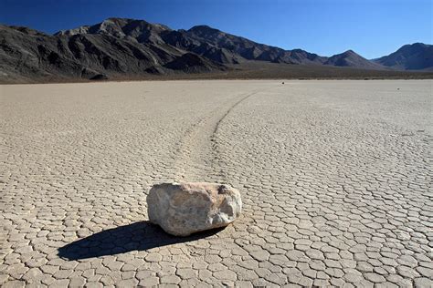 moving rocks of la playa in Death valley Photograph by Pierre Leclerc ...