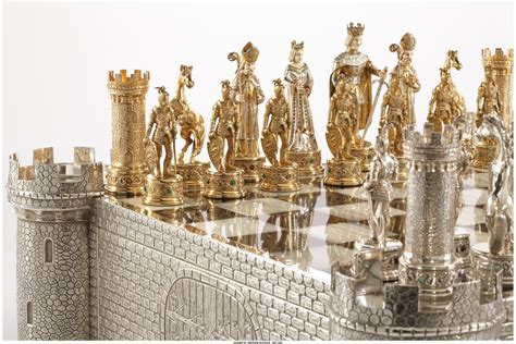 A GERMAN JEWEL ENCRUSTED SILVER AND BONE CHESS SET. Unknown maker ...