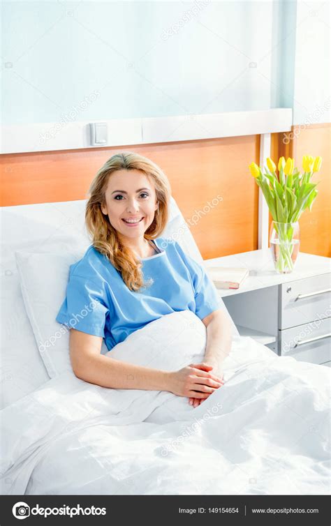 Woman lying in hospital bed — Stock Photo © ZaraMuzafarova #149154654