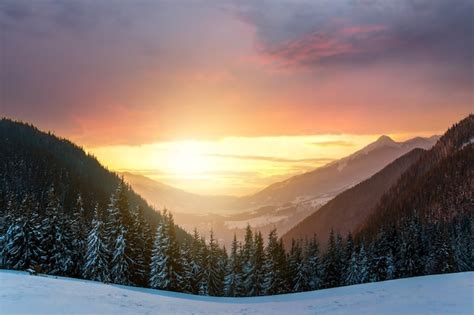 Premium Photo | Soft sunset in winter snow covered mountains with dark ...