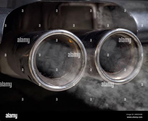 Smoking car exhaust Stock Photo - Alamy