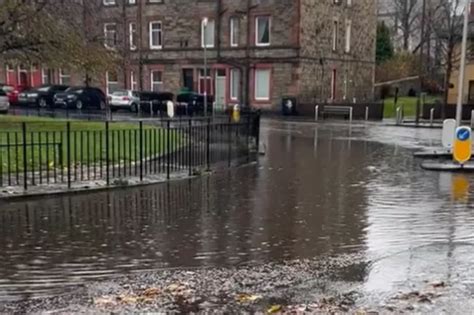 Edinburgh flooding sees 'loch' form on city road after heavy rain ...