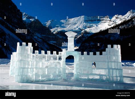 Ice castle on a frozen lake, Lake Louise, Victoria Peak, Banff National ...