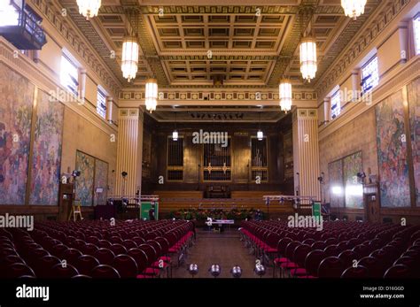 The ornate interior of the mural covered Brangwyn Hall, Swansea Wales ...