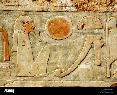 Seated pharaoh and eye of Horus hieroglyph on the Mortuary Temple of ...