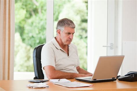 Premium Photo | Man working on his laptop