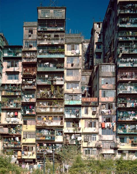 many balconies and windows on the side of an old building