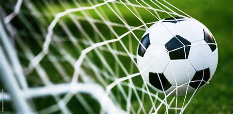 Soccer ball in goal Stock 写真 | Adobe Stock