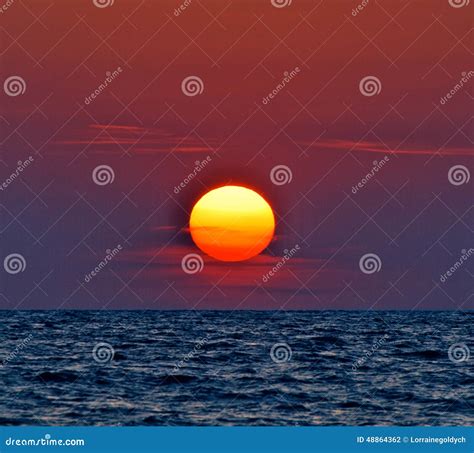 Red purple sunset on water stock photo. Image of blue - 48864362