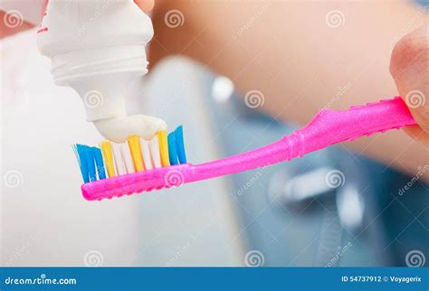 Woman Hands Putting Toothpaste on Toothbrush Stock Photo - Image of ...