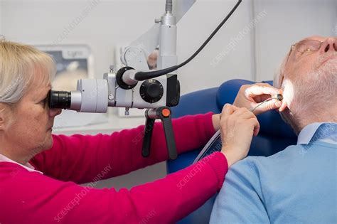 Ear wax removal clinic - Stock Image - C038/2556 - Science Photo Library