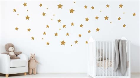 Premium AI Image | White wall with golden stars stickers in baby room ...