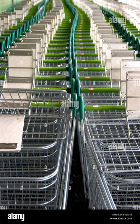 snaking line of waitrose shopping trolleys, outside a waitrose store in ...