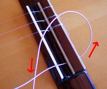 Restringing a classical guitar - how to tie those knots - pictures ...