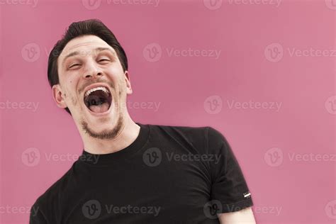 Handsome man portrait laughing out loud 1217109 Stock Photo at Vecteezy