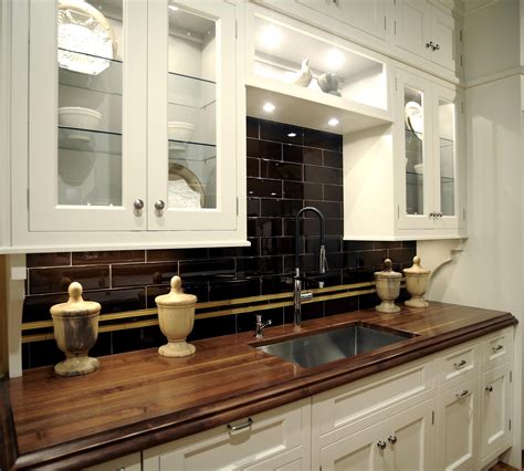 Wood countertops, white cabinets, black backsplash | Wood countertops ...