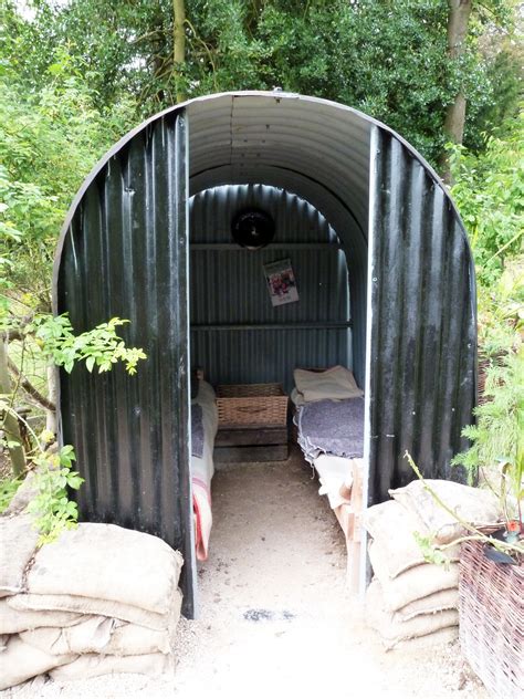 Anderson shelter in Chatsworth Castle Park, UK. Air-raid shelter made ...