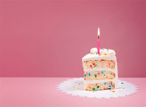 Slice Of Birthday Cake With Candle On Pink Stock Photo - Download Image ...