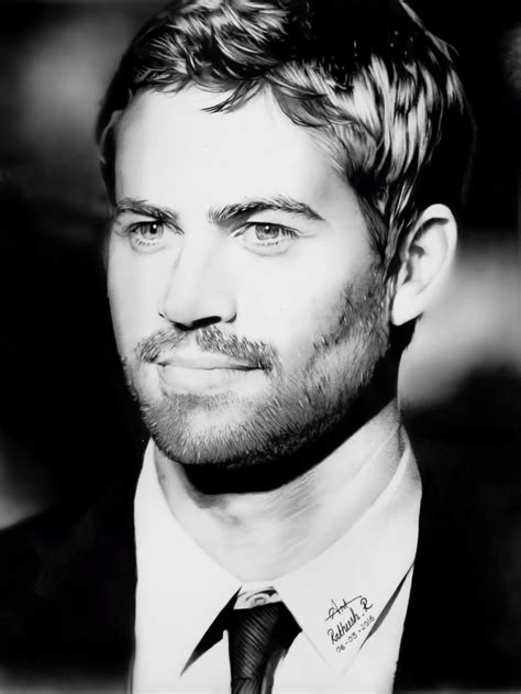 a black and white photo of a man in a suit with a beard wearing a tie