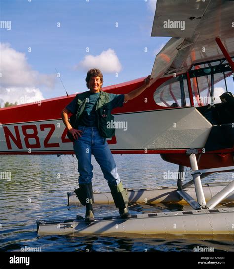 Pilot and her Piper Super Cub on floats Stock Photo - Alamy