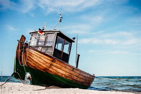 "Traditional Fishing Boat At The Shore" by Stocksy Contributor "Claudia ...