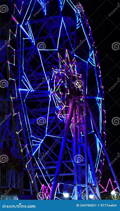 Carousels at night stock image. Image of amusement, side - 264706821