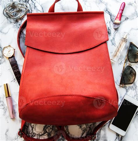 Red leather backpack with accessories 5697263 Stock Photo at Vecteezy