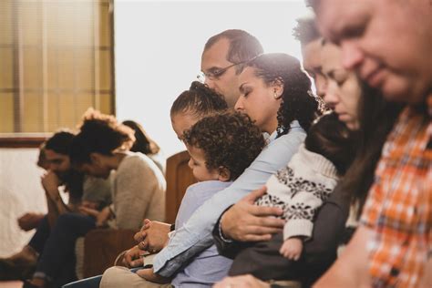 Congregation Members Praying Together - Church stock photos