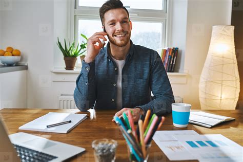 Smiling man working at desk office stock photo (133833) - YouWorkForThem