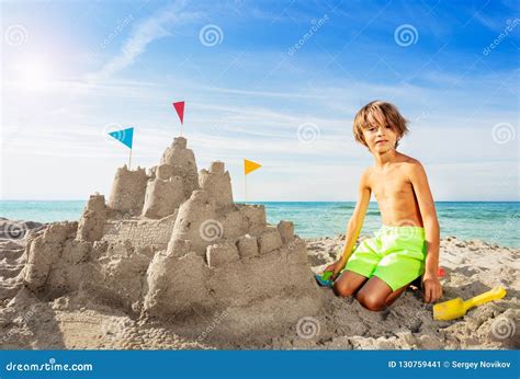 Happy Boy Building Big Sand Castle on the Beach Stock Image - Image of ...