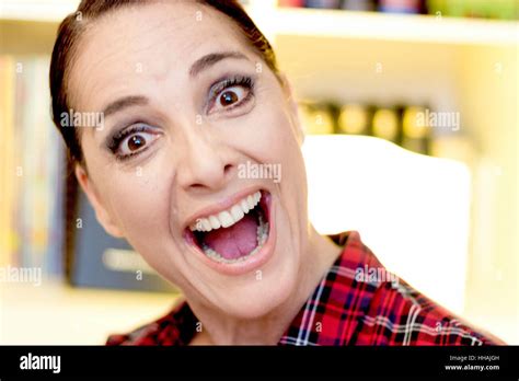 Portrait of a woman making wow, big smile, open mouth Stock Photo - Alamy