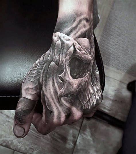 Skull Hand Tattoo Designs