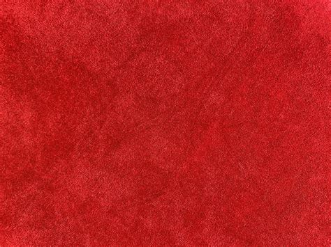 Dark red velvet fabric texture used as background. Empty dark red ...