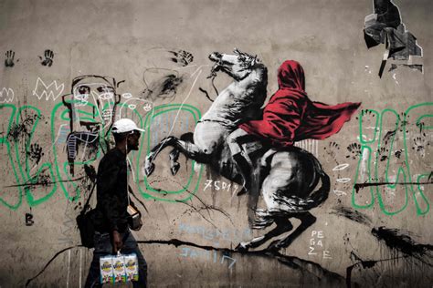 New Banksy street art appears across Paris, taking aim at refugee crisis