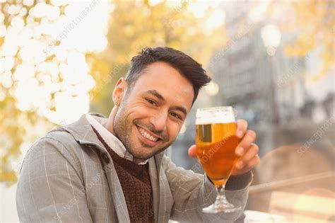 Young man drinking beer - Stock Image - F018/6363 - Science Photo Library