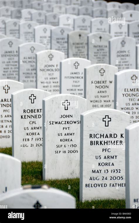 Long rows of headstones of veterans at the National Cemetery of the ...