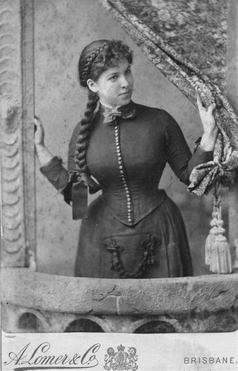 an old black and white photo of a woman