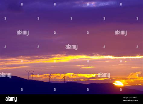 sunset with wind turbines Stock Photo - Alamy