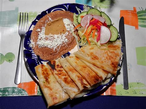 Premium Photo | A plate of sincronizadas flour tortillas stuffed with ...