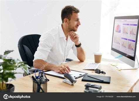 Young Business Man Working On Computer In Office. Stock Photo by ...