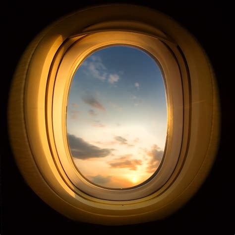 Premium Photo | Sunset from airplane window, cropped square