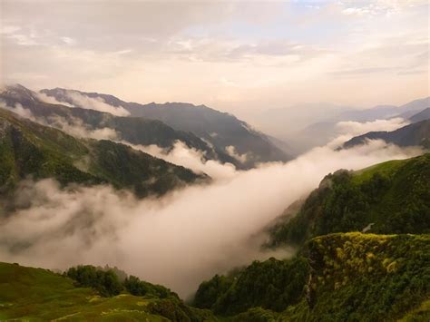 Premium Photo | Mountain landscape with fog in the morning