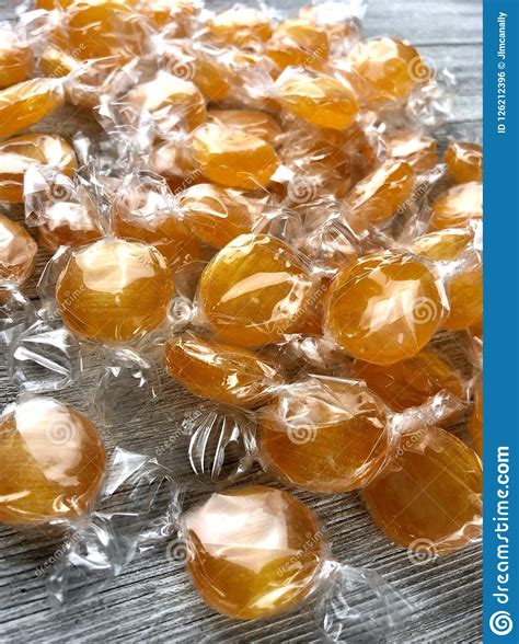 Wrapped Butterscotch Candies Stock Photo - Image of surface, disc ...