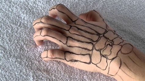 20 fascinating skeleton hand tattoo ideas to decorate your skin - YEN ...