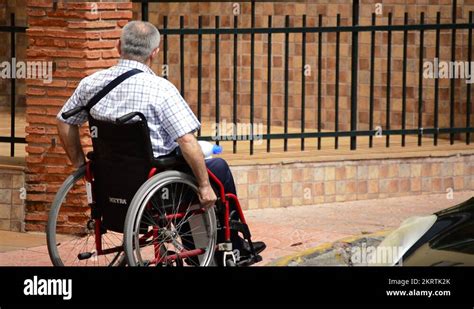 Paraplegic or quadriplegic man in wheelchair Stock Video Footage - Alamy