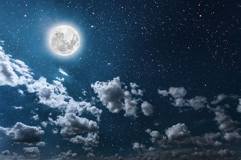 Premium Photo | Night sky with stars and moon and clouds.