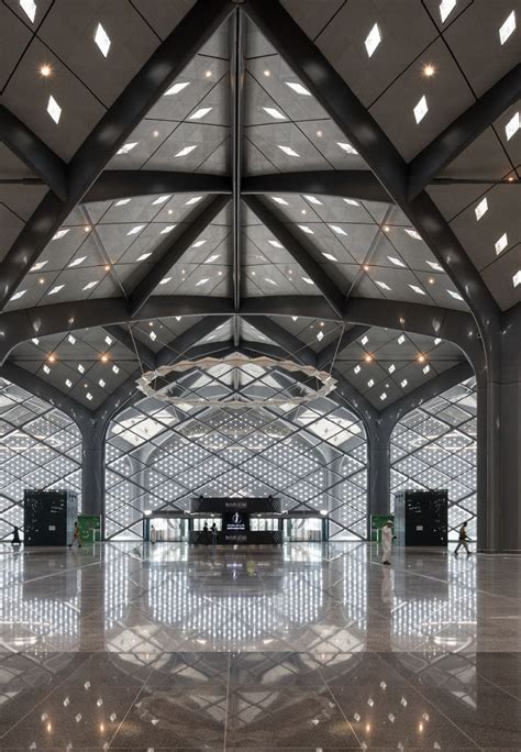 the inside of an airport terminal with lots of windows and lights on it ...