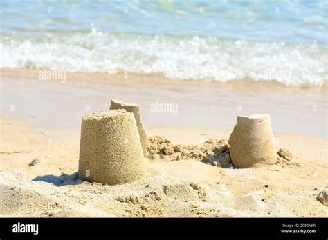 small and simple sand castles on the beach Stock Photo - Alamy