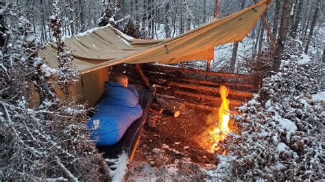 Winter Camping in Snow Storm with Survival Shelter Bushcraft Cot. - en ...