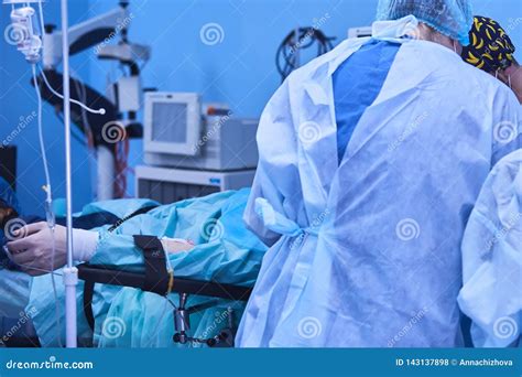 Serious Surgeons during a Surgery in the Hospital. Cross Process Stock ...